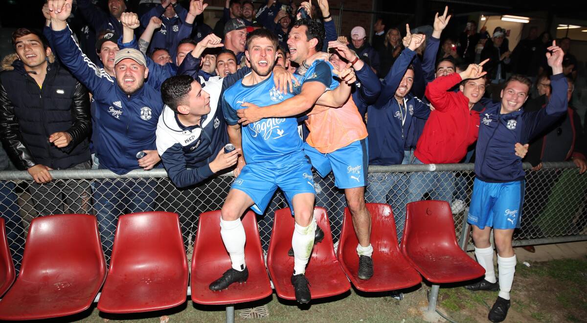 TITLE DEFENCE?: Hanwood players celebrate with fans after beating Lake Albert after extra times in last year's Pascoe Cup grand final at Equex Centre. Picture: Les Smith