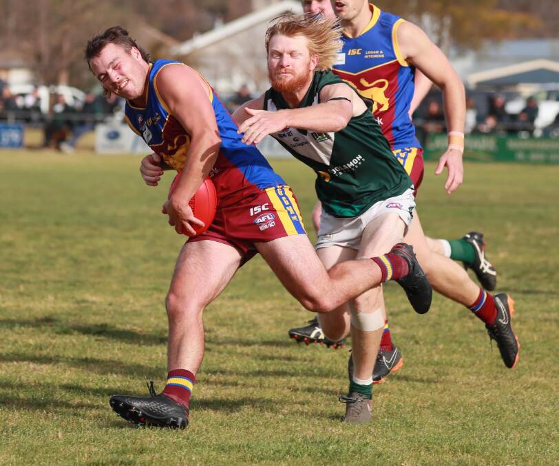 TOO STRONG: Ganmain-Grong Grong-Matong's Kai Watts tries to slip a Jeremy Sykes tackle during Saturday's win. Picture: Les Smith