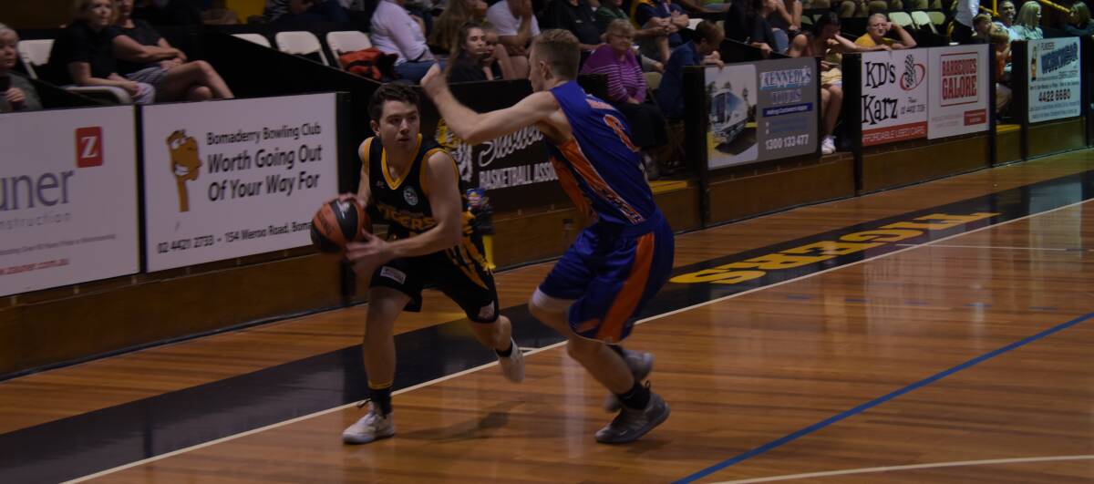 TOUGH LOSS: Wagga Heat's Zac Maloney tries to shut down Shoalhaven's Billy Campbell during Saturday's loss to the Tigers. Picture: Courtney Ward.