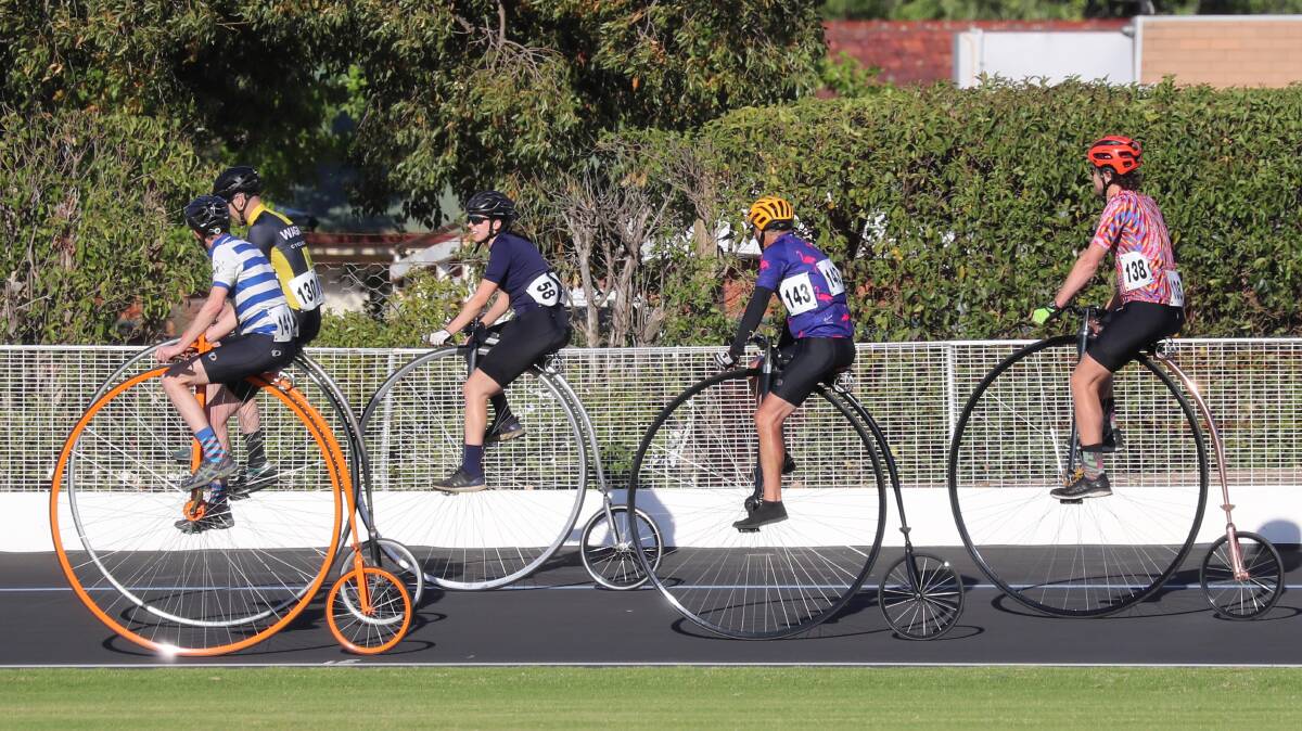 ON TRACK: Penny farthing competitors do battle during last years Golden Wheel Track Carnival. Picture: Les Smith