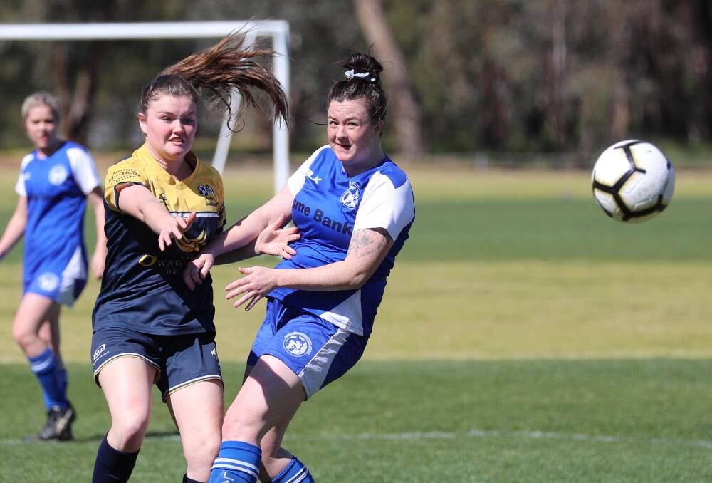 Tolland's Rachael Waller and Junee's Abby Foley in action during last year's Leonard Cup finals. Picture: Les Smith
