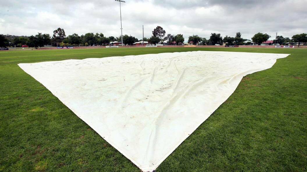RAIN RAIN GO AWAY: The Harris Park wicket is covered after wet weather forced round one to be washed out earlier this season. Picture: Les Smith