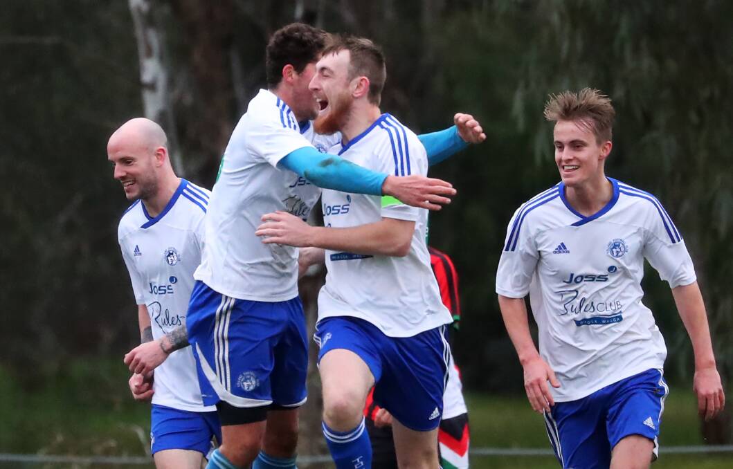 EQUALISER: Tolland skipper Jayden Beattie is congratulated by teammates after scoring a goal in Sunday's 1-all draw with Lake Albert. Picture: Emma Hillier