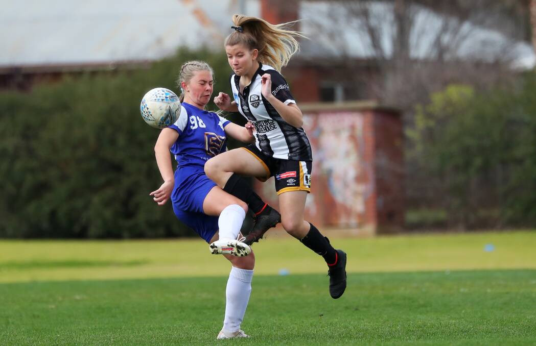 Zoe Neuss and Beth Huxley clash in a under-17s game between Canberra Olympic and Wagga City last year. Picture: Emma Hillier

