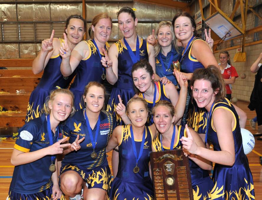 FINALS GLORY: Caren Hugo (back, third from left) celebrates with teammates after Narrandera won the 2012 Wagga first grade grand final. 