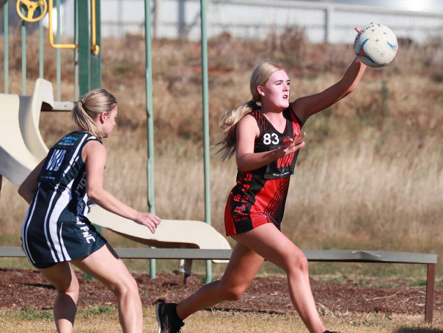 Marrar's Bella Hofert grabs possession ahead of Coleambally's Emma Woolnough on Saturday. Picture: Les Smith