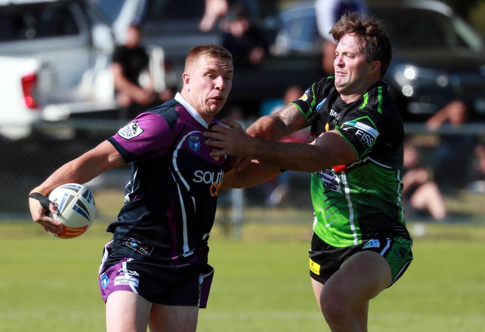 TRY FEST: Southcity's Cody Hodge tries to shake off a tackle from Albury's Harrison Reicher during his three-try performance on Sunday. Picture: Les Smith