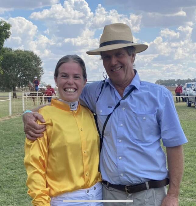 ALL SMILES: Jockey Emily Waters with father Mont after she won her first race at Tullibigeal on Saturday. 