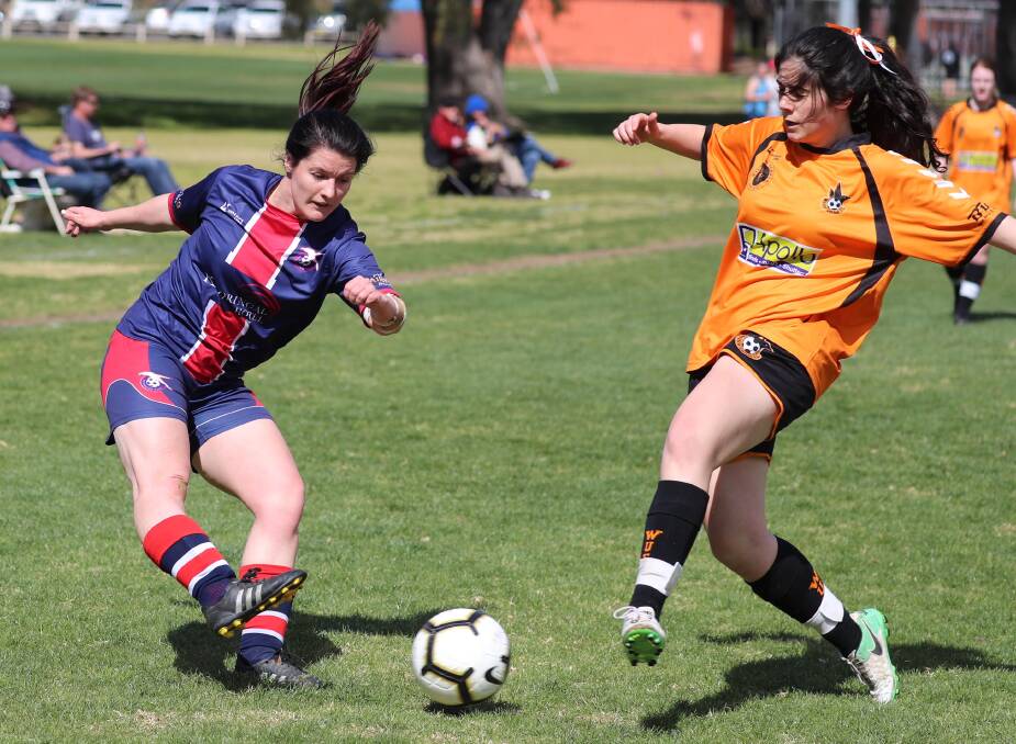 EXTRA TIME THRILLER: Henwood Park's Bronte Buik and Wagga United's Catherine Fsadni compete for the ball during Sunday's Leonard Cup elimination final. Picture: Les Smith