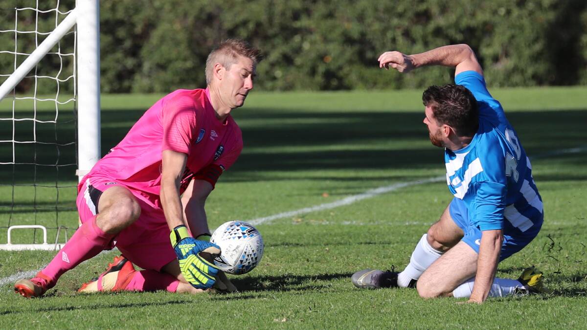 BIG GAME: Wanderers captain and goalkeeper Robert Fry thwarts an attack in the home win over ANU a fortnight ago. Picture: Les Smith. 