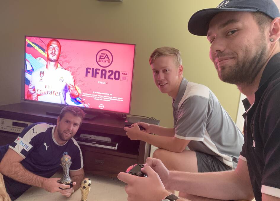 PRACTICE RUN: Former Football Wagga development officer Liam Dedini, replacement Kyle Yeates and player Jake Ploenges practice FIFA 20.