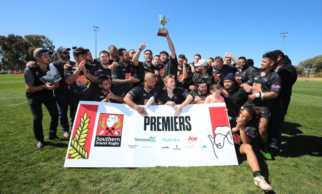 CHAMPIONS: The Griffith Blacks celebrate their McMullen Cup third grade grand final win over Deniliquin on Saturday. Picture: Les Smith