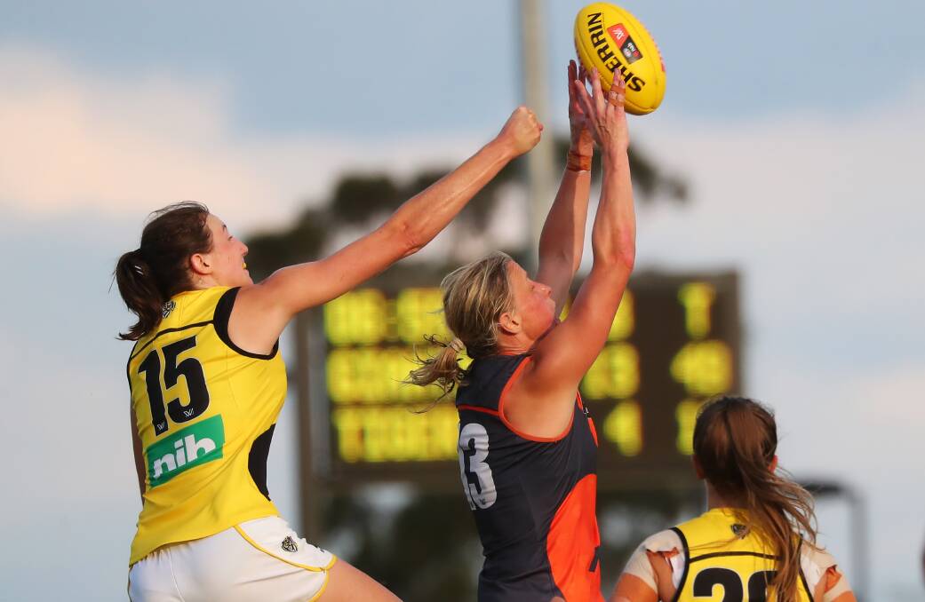 WINNING FEELING: Richmond's Rebecca Miller tries to spoil a marking attempt from GWS' Cora Staunton during last year's AFLW clash in Wagga. Picture: Emma Hillier