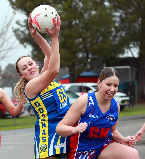 RAIN TUSSLE: Mangoplah-Cookardinia United-Eastlakes' Ashley Reynoldson and Turvey Parks' Alane Marks jostle for the ball on Saturday. Pictures: Emma Hillier