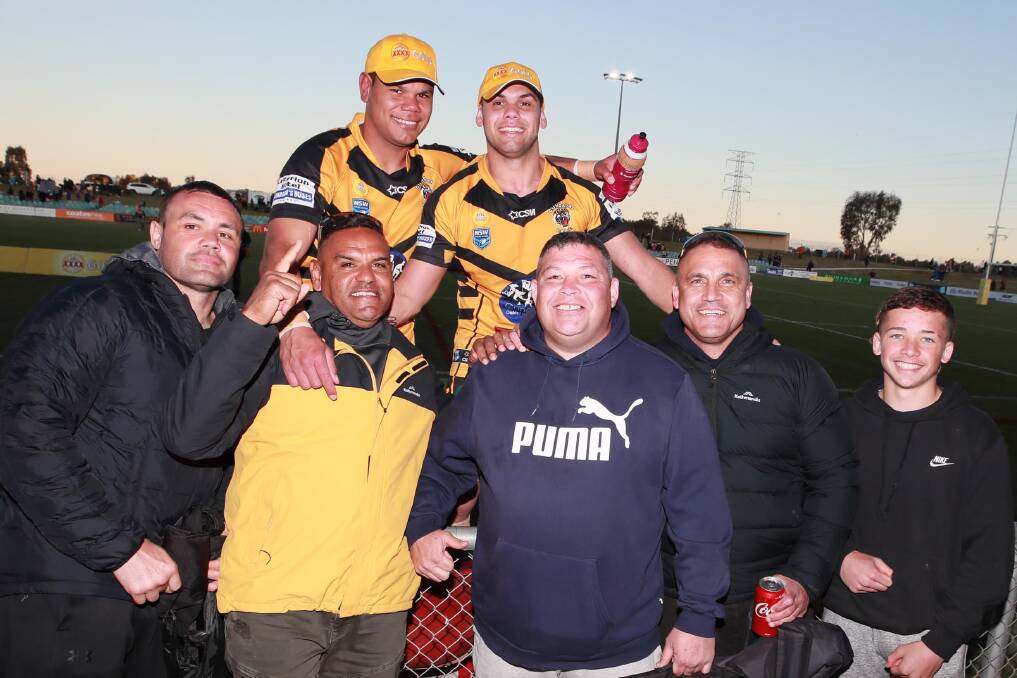 GOOD TIMES: Jack and Mathew Lyons with members of their support network after Gundagai's grand final win. Picture: Les Smith
