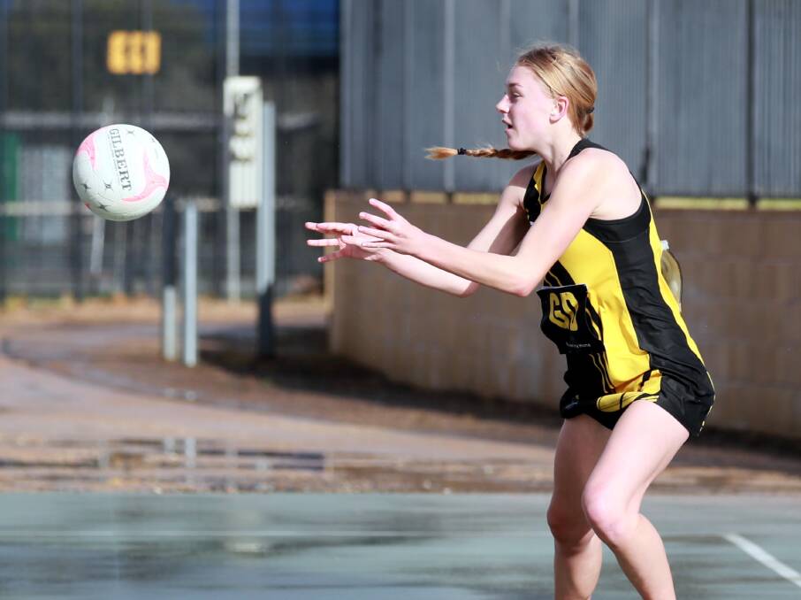 YOUNG GUN: Claudia Wheatley takes a pass during Saturday's win over Leeton-Whitton at Robertson Oval. Picture: Les Smith