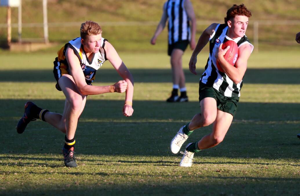 TOO GOOD: The Riverina Anglican College's Sam McNaughton evades Kooringal High School's Connor Allan on Wednesday. Picture: Les Smith