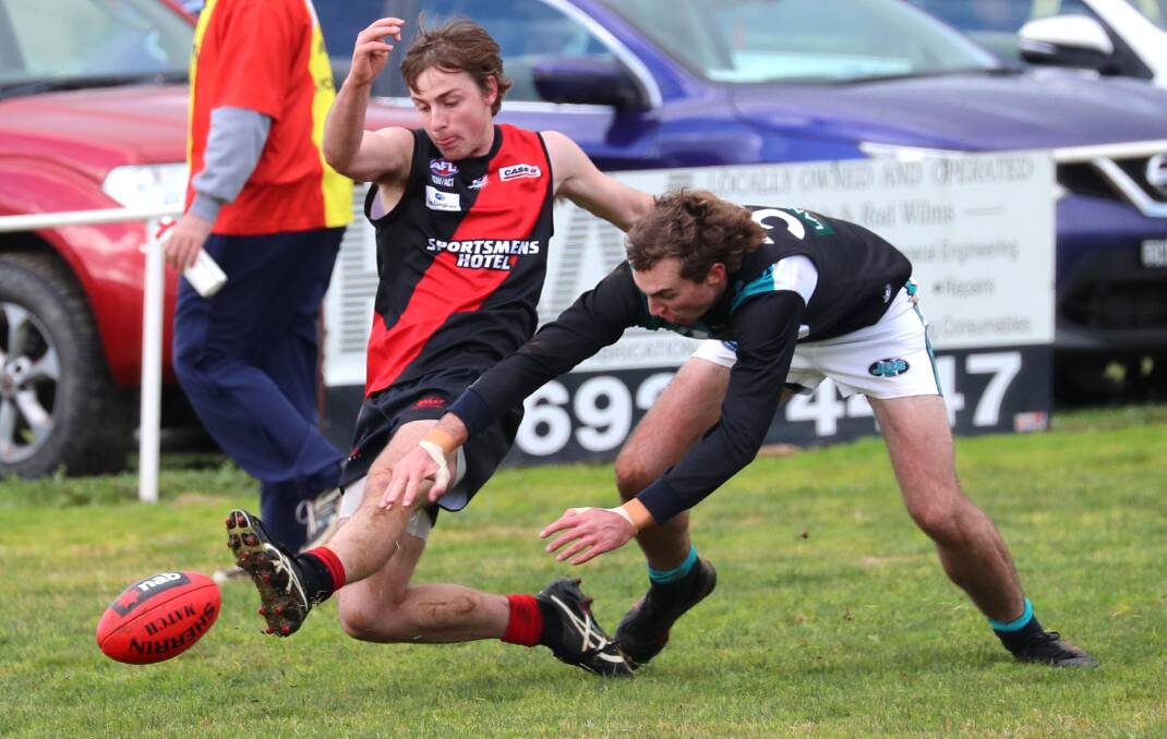 UP IN AIR: Marrar's Rhys Mooney and Northern Jets' Mitch Doyle competing in a Farrer League match last year. Picture: Les Smith
