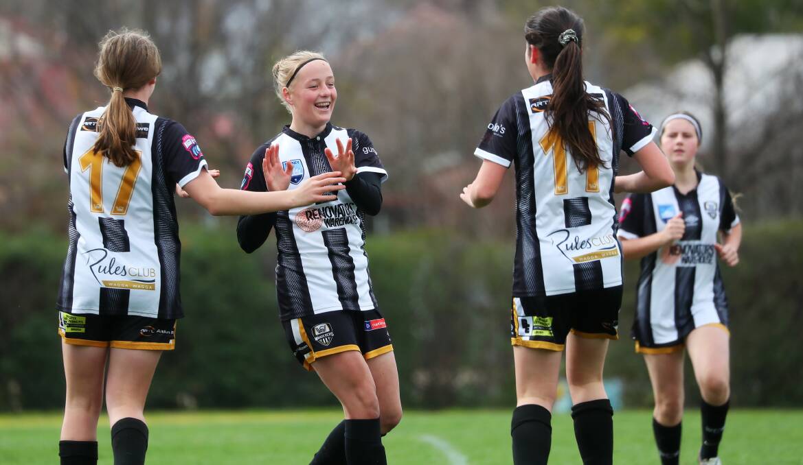 SCORING THREAT: Megan Castle (centre) celebrates scoring a goal with teammates during a clash with Canberra Olympic last month. Picture: Emma Hillier 