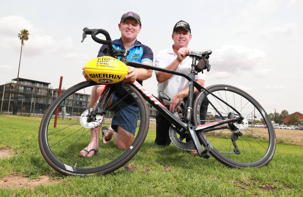 GOOD CAUSE: Pedalcure 4MND organiser John Fox with Ben Hogg before they embark on a ride from Ungarie to Melbourne to raise money for MND research. Picture: Les Smith