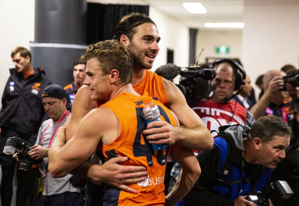 HOMECOMING: Jeremy Finlayson embraces fellow Riverina product Jacob Hopper after a match last season. Picture: GWS Giants