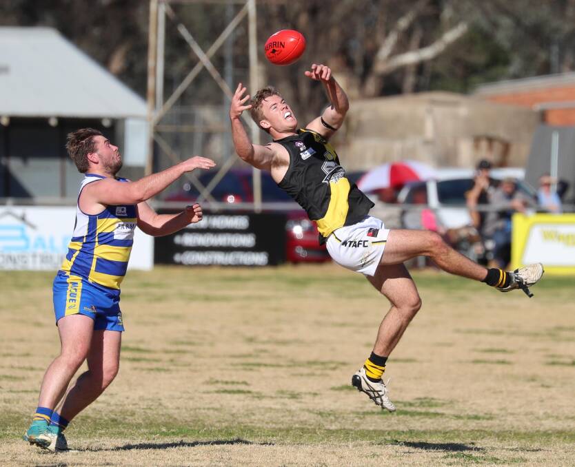 BACK IN FOLD: Wagga Tigers defender Dylan Morton goes for a mark against MCUE earlier this year. Picture: Les Smith 