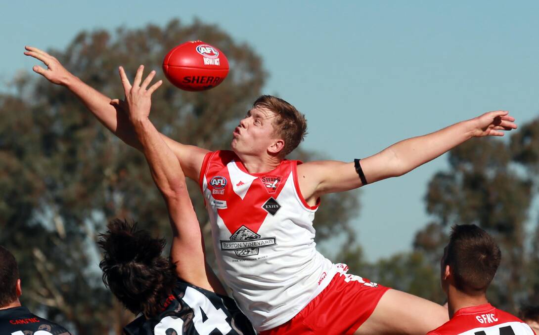 The Demons proved too strong for the Swans at Crossroads Oval. Pictures: Les Smith