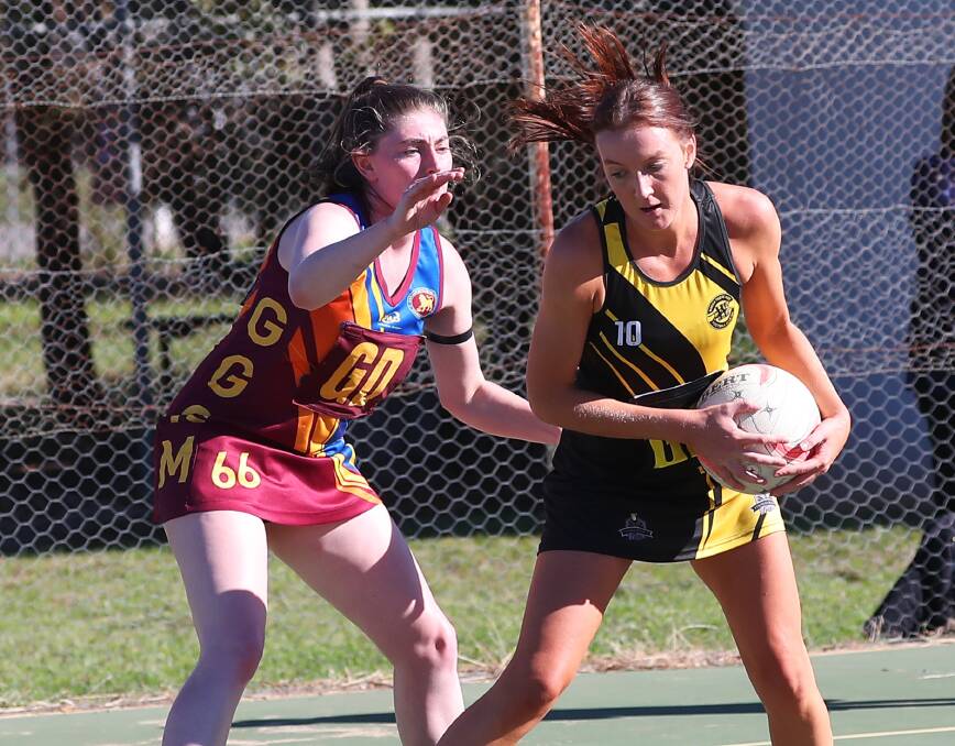 STEPPING UP: Skippers Alice Kenny (Ganmain-Grong Grong-Matong) and Jess Allen (Wagga Tigers) go head to head during Saturday's netball clash. Picture: Emma Hillier.