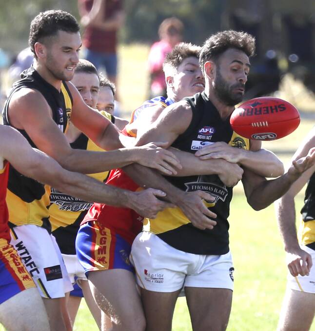 BACK IN FOLD: Wagga Tiger Jesse Manton looks to grab possession during Sunday's loss to Ganmain-Grong Grong-Matong. Picture: Les Smith