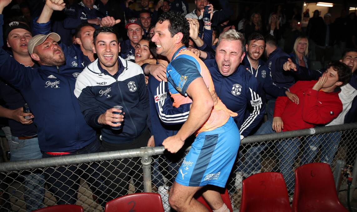 MEMORABLE MOMENT: Joey Schirripa celebrates with Hanwood fans after scoring both goals in last year's 2-1 grand final win. Picture: Les Smith