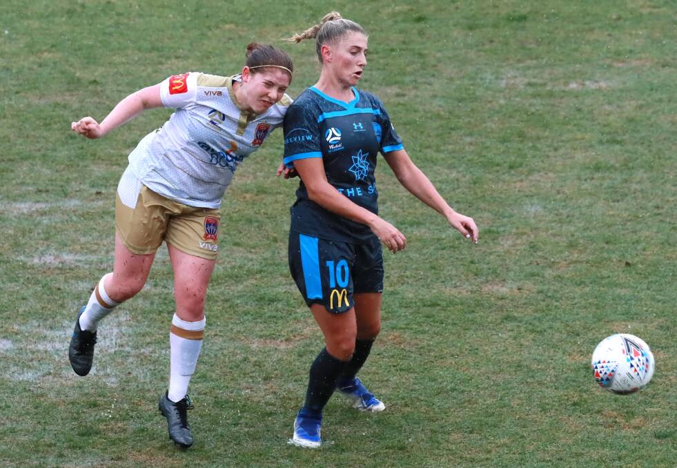 WILD WAGGA: Newcastle's Annabel Martin and Sydney FC's Remy Siemsen do battle on Sunday. Picture: Les Smith