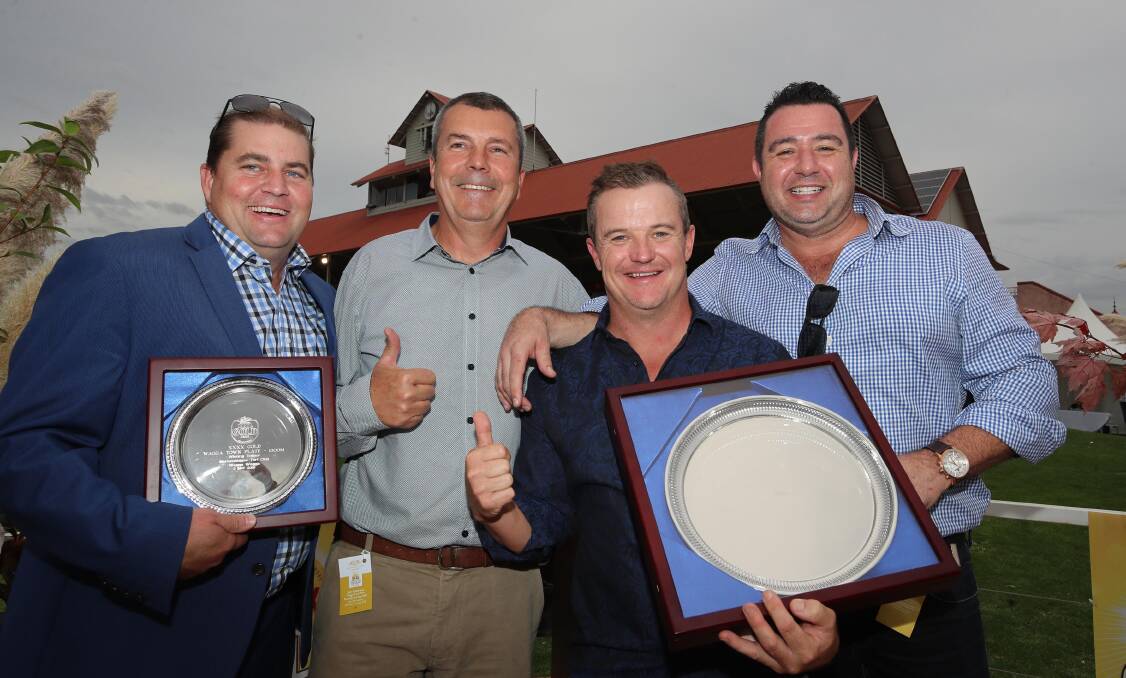 WINNING FEELING: Ghostly's trainer David Pfieffer (left) celebrates with Ghostly's part owners after last year's win. Picture: Les Smith