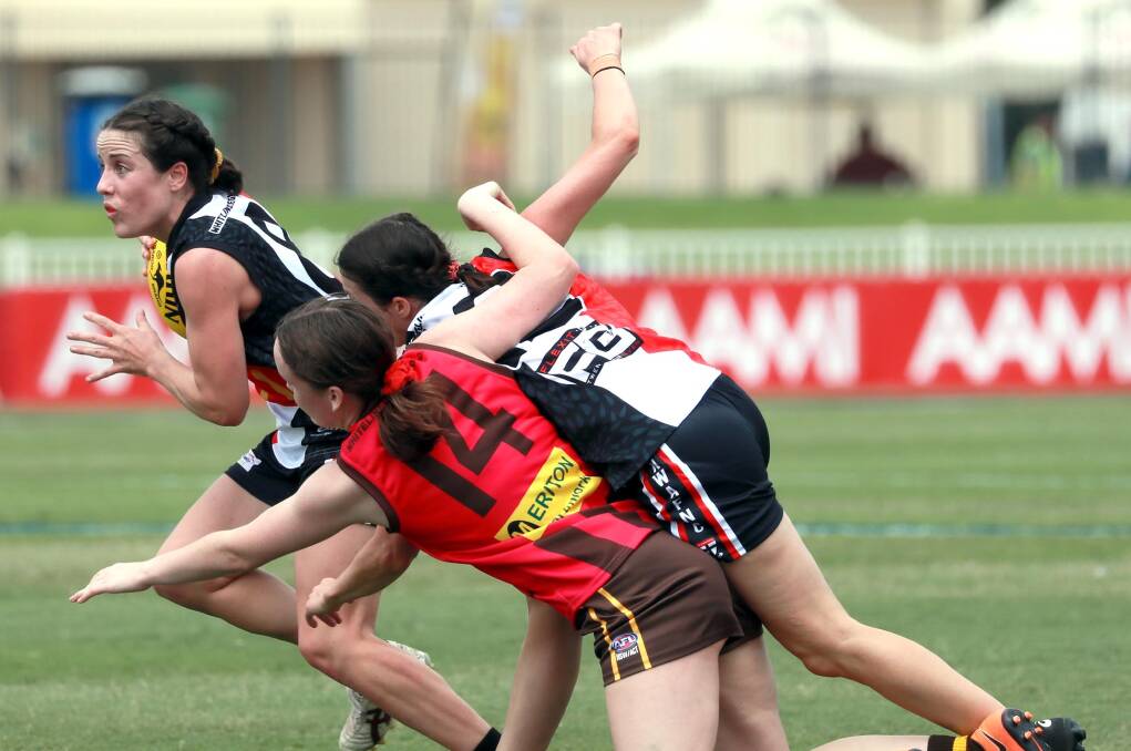 STILL UNBEATEN: North Wagga's Megan Porter emerges from a pack during Saturday's win over East Wagga Kooringal. Picture: Les Smith