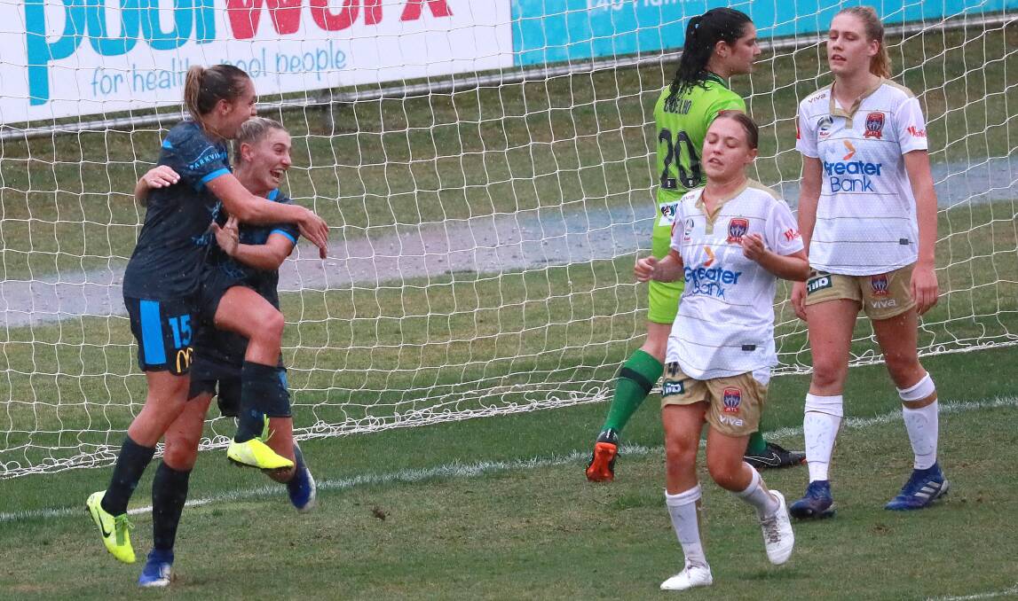 BIG OPPORTUNITIES: Sydney FC's Mackenzie Hawkesby celebrates with teammate Remy Siemsen after scoring a goal during the recent W-league trial against Newcastle in Wagga. Picture: Les Smith