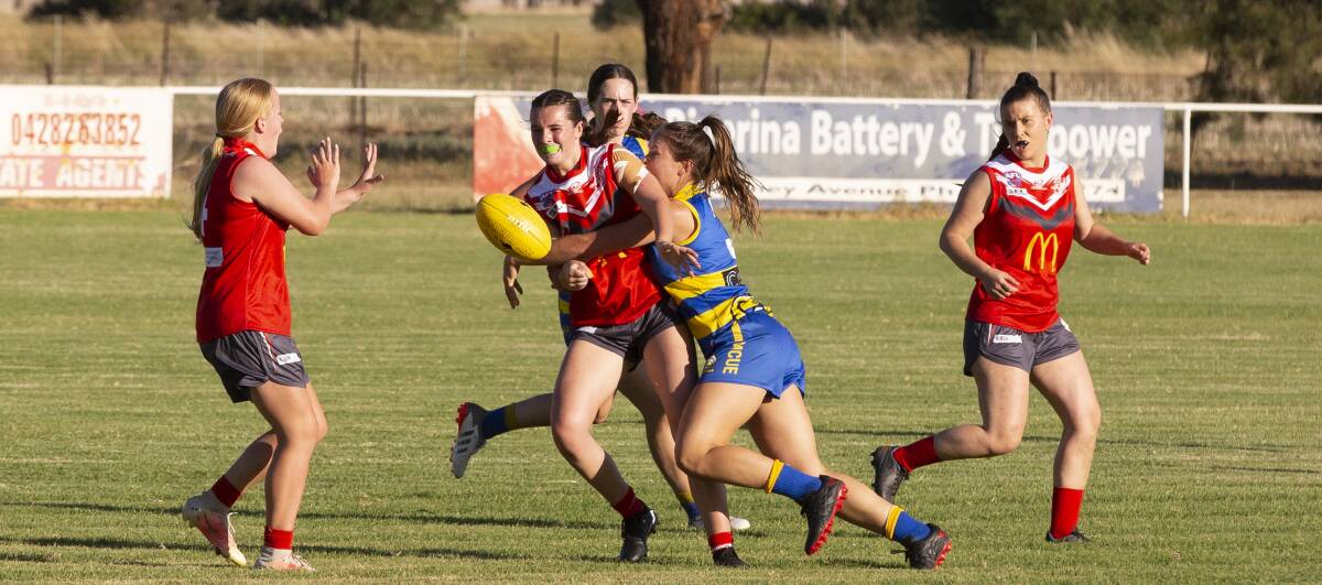 CRUNCH TIME: Collingullie-Glenfield Park's Sidonie Carroll is tackled against MCUE. Picture: Madeline Begley 
