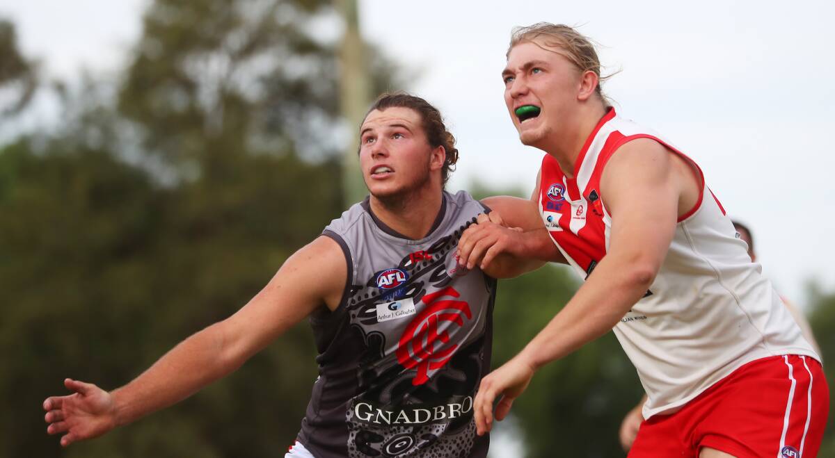 Collingullie's Matthew Hobbs battles with Griffith's Nathan Richards earlier this year. Picture: Emma Hillier
