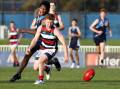 TOO CLASSY: Kildare Catholic College's Jackson Connolly and Wagga High's Lucas Brett hunt the ball during Wednesday's Carroll Cup clash. Picture: Les Smith