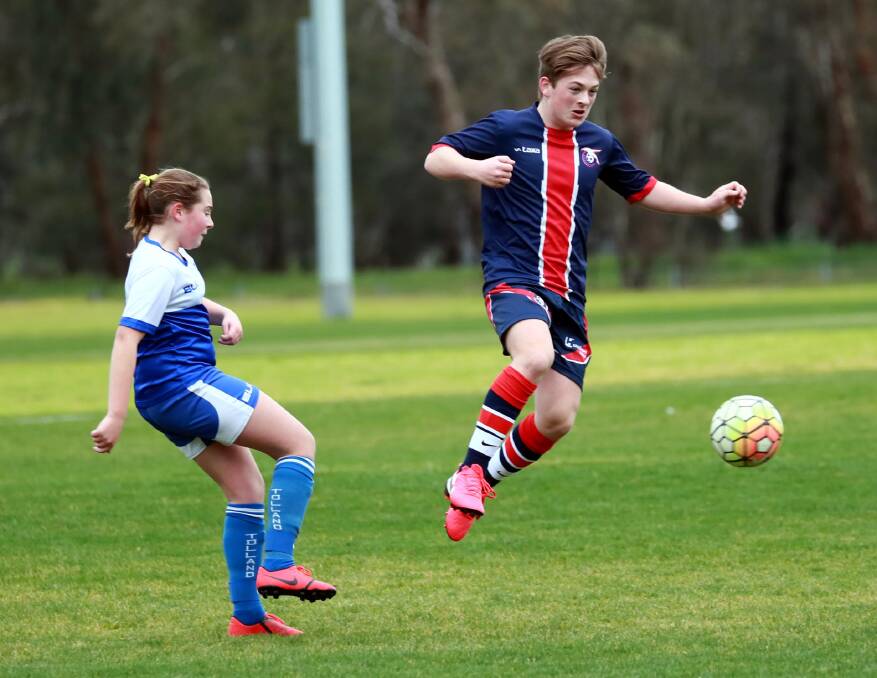  TOUGH TUSSLE: Tolland's Katie Blake and Henwood Park's Ashton Richardson rise to the challenge in their under-13 game. 