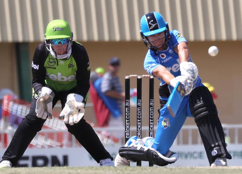 BIG BASH: Sydney Thunder keeper Rachel Priest watches on as Adelaide's Bridget Patterson unleashes a shot during WBBL action at Wagga in 2018. Picture: Les Smith