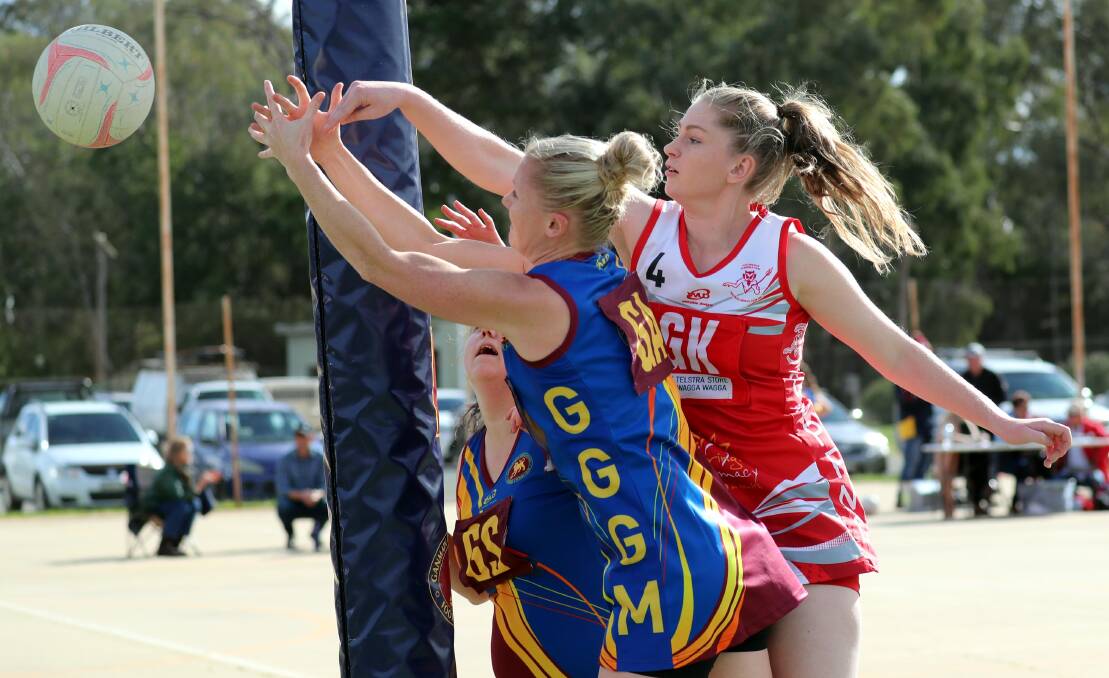 DEFENCE KEY: Collingullie-Glenfield Park coach Brigetta Hart (right) will have her hands full against MCUE youngsters Sophie Fawns and Katie Caller in Saturday's semi final. 
