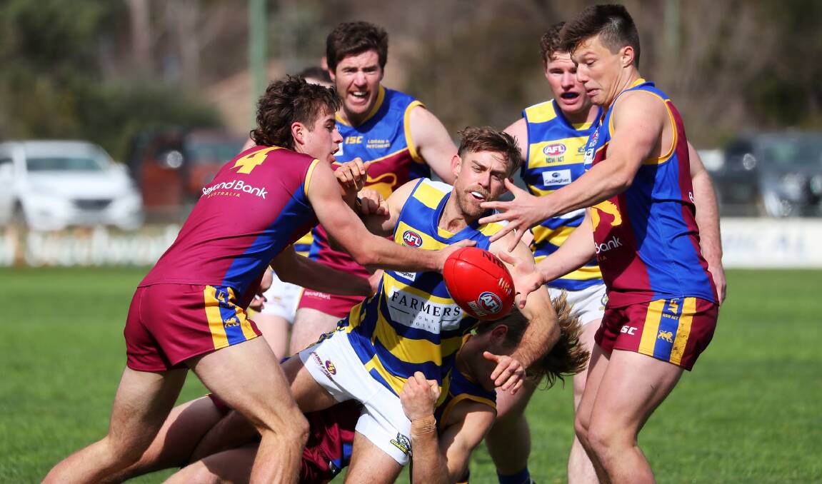 CRUNCH GAME: MCUE's Hunter Lloyd looks to get the ball out of a pack against GGGM last weekend. Picture: Emma Hillier
