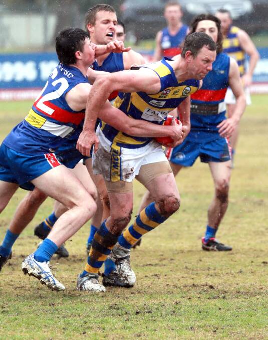CHANCE TO ATONE: MCUE's Chris Willis looks to burst through Turvey Park tacklers during their round three clash. Picture: Les Smith