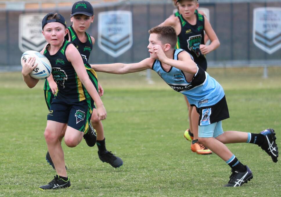 TOUGH FINAL: Wagga Viper Ashton Feary is tagged by Cronulla's Pax Cain during their under-10 final loss to the Sharks on Sunday at Jubilee Park. Picture: Les Smith