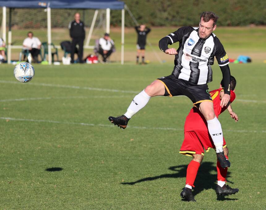 BACK AT SHARKS: Justin Curran playing for Wagga City Wanderers last year. Picture: Les Smith