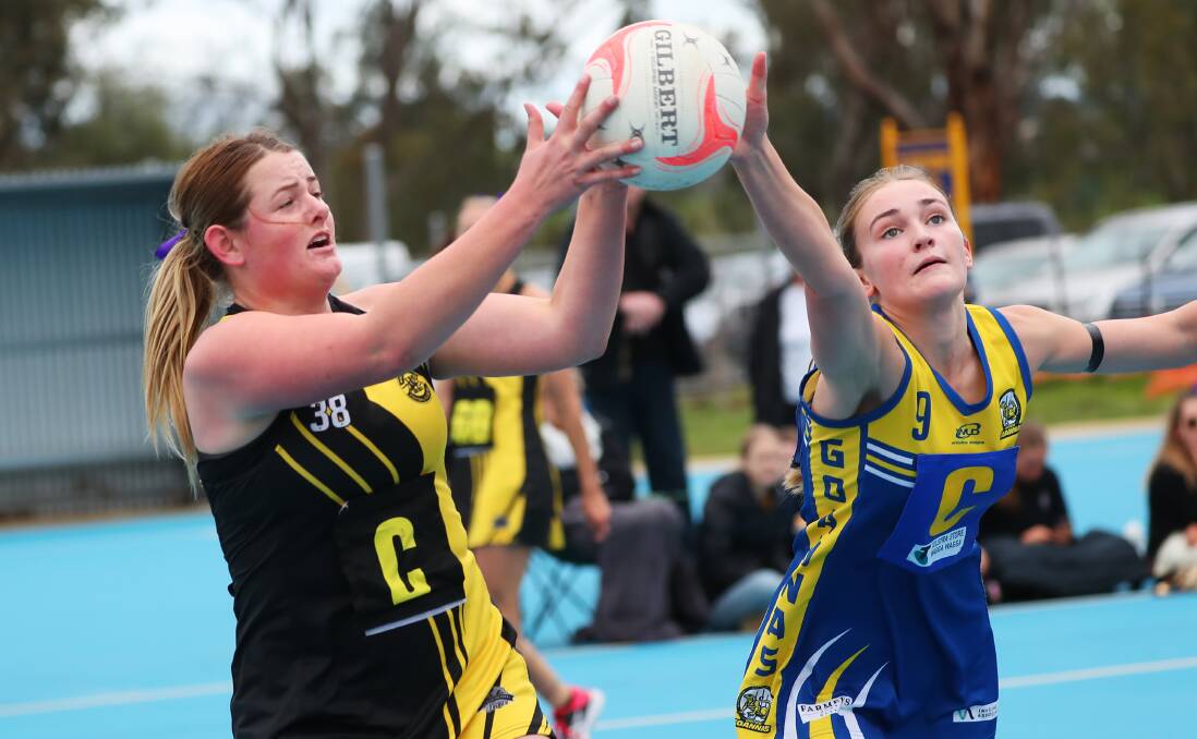 TOO STRONG: Wagga Tigers' Olivia Tilyard and MCUE's Phoebe Wallace battle for the ball at Mangoplah Sportsground on Saturday. Picture: Emma Hillier