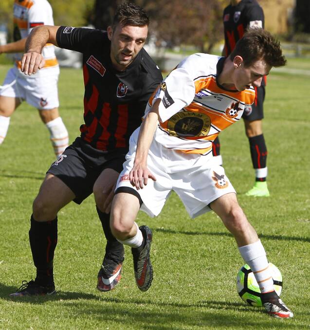 GOAL HAUL: Adam Raso (left) scored four goals in Leeton United's 7-1 rout of Lake Albert. Picture: Les Smith