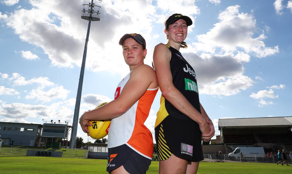 MAKING STRIDES: Richmond's Rebecca Miller (right) with GWS Giant Alyce Parker before the AFLW clash at Wagga in 2020. Picture: Les Smith