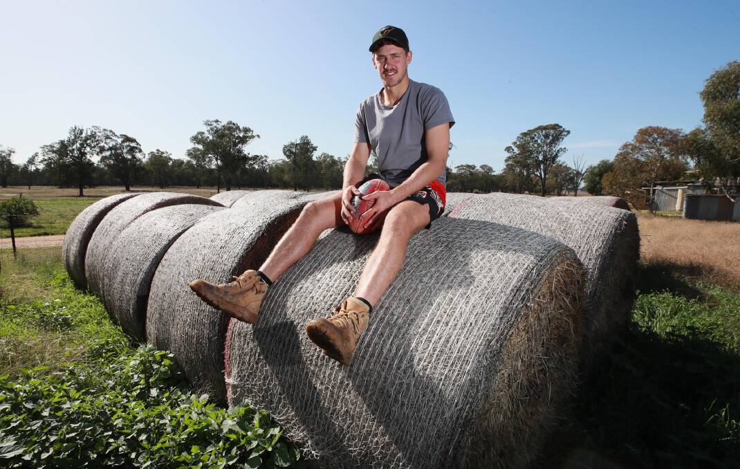 DOWN TIME: Greater Western Sydney Giants star Harry Perryman relaxing on the family's Collingullie farm on Thursday, with the AFL season currently suspended due to coronavirus. Picture: Les Smith