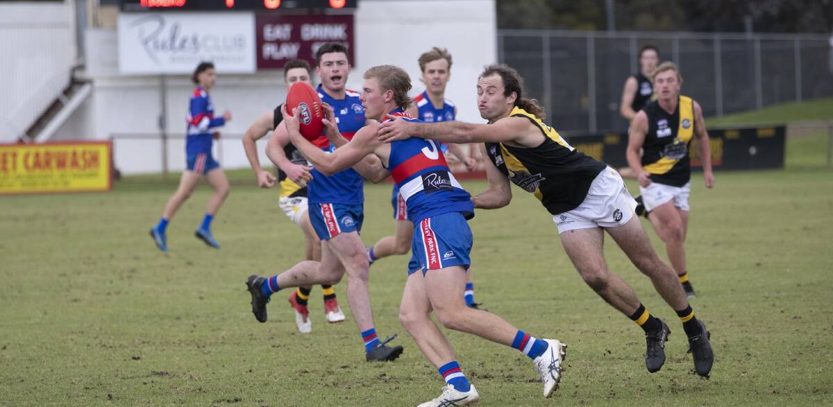 CRUCIAL WIN: Turvey Park captain Jack Haggar is tackled by Wagga Tiger Jimmy McCoullough. Picture: Madeline Begley 
