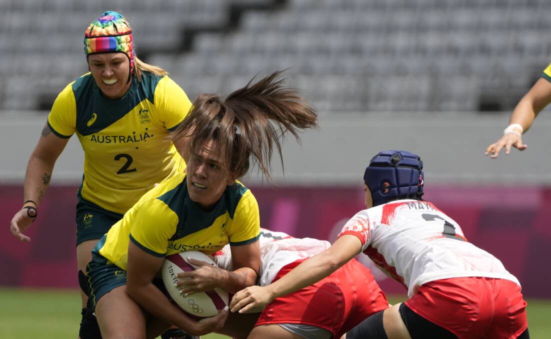 DOMINANT: Batlow's Sharni Williams (background) during the win over Japan. Picture: AAP Images